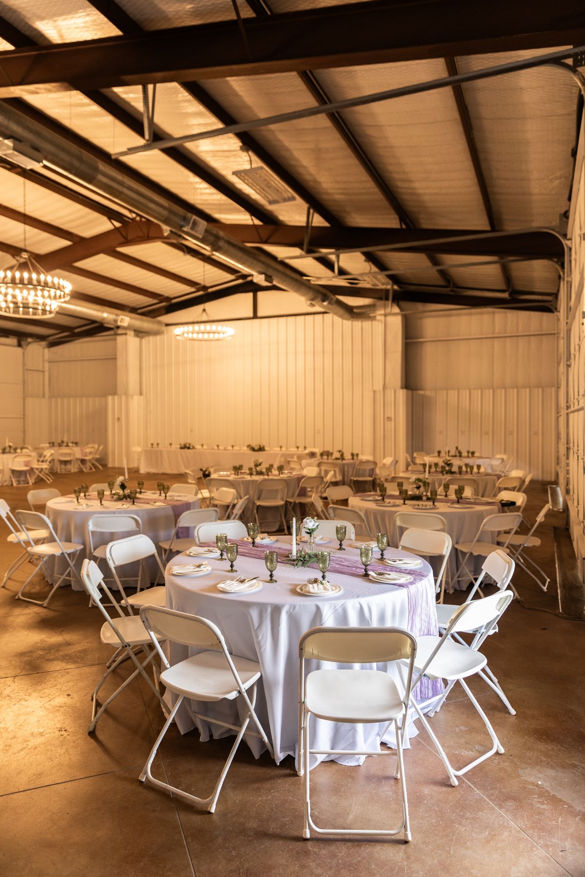 Round reception tables set for a wedding at Heritage Hall